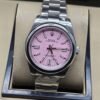 Rolex — esfera rosa con índices plateados y brazalete plateado · 41 mm