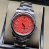 Rolex — esfera roja con índices plateados y brazalete plateado · 41 mm