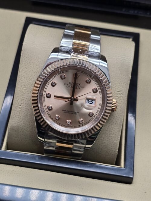 Rolex — esfera rosada con bisel rosado y brazalete bicolor · 41 mm
