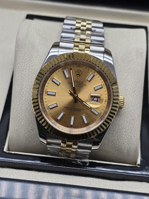 Rolex — esfera dorada con bisel dorado estriado y brazalete bicolor · 41 mm