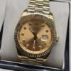 Rolex — esfera dorada con índices brillantes y brazalete dorado · 41 mm
