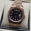 Rolex — esfera negra texturizada con bisel rosado y brazalete rosado · 41 mm