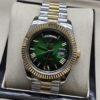 Rolex — esfera verde con números romanos y bisel dorado y brazalete bicolor · 41 mm