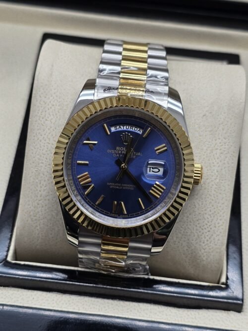 Rolex — esfera azul con bisel dorado y brazalete bicolor · 41 mm