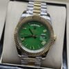 Rolex — esfera verde con bisel dorado y brazalete bicolor · 41 mm