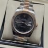 Rolex — esfera gris con bisel rosado y brazalete bicolor · 41 mm
