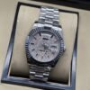 Rolex — esfera plateada brillante con bisel estriado y brazalete plateado · 36 mm