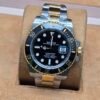 Rolex — esfera negra y brazalete bicolor