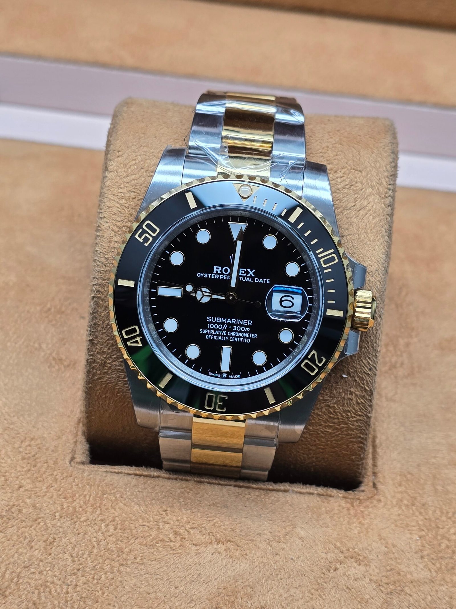 Rolex — esfera negra y brazalete bicolor