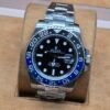 Rolex — bisel negro y azul · brazalete plateado