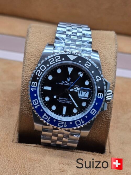 Rolex — bisel negro y azul · brazalete de cinco eslabones