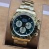 Rolex — esfera verde y brazalete dorado