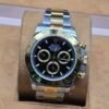 Rolex — esfera negra con subesferas y brazalete bicolor