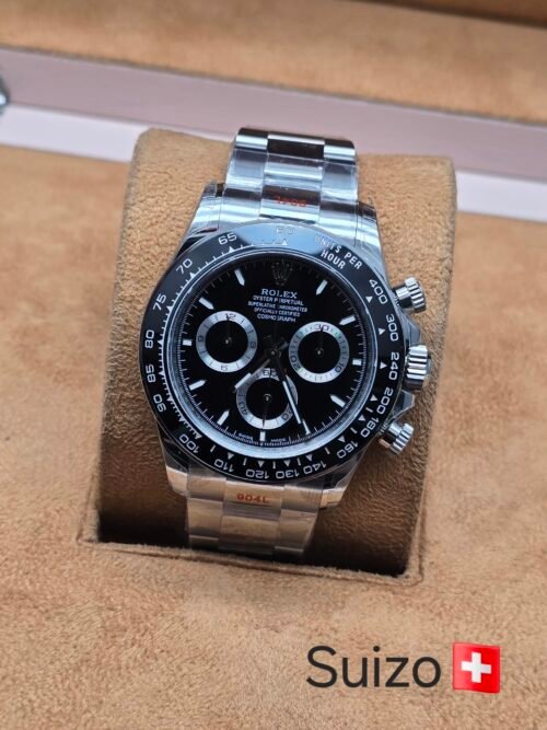 Rolex — esfera negra con tres subesferas · brazalete plateado