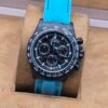 Rolex — esfera oscura y correa turquesa