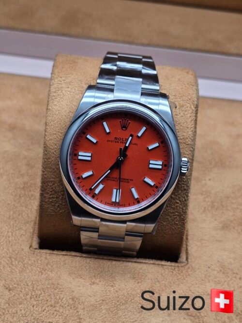 Rolex — esfera naranja y brazalete plateado