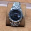 Rolex — esfera gris con números romanos · 36 mm