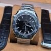 Omega — esfera negra y bisel gris