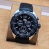 TAG Heuer — esfera negra con subesferas y correa negra