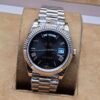 Rolex — esfera negra y brazalete tono rosado