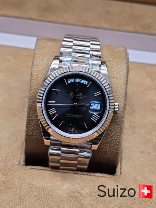 Rolex — esfera negra y brazalete tono rosado