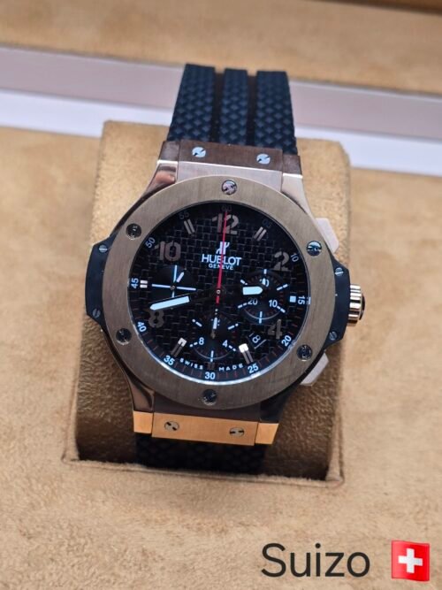 Hublot — esfera negra · bisel rosado y correa texturizada