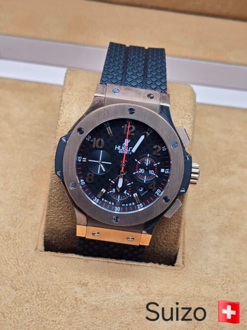 Hublot — esfera negra con tres subesferas · caja rosada