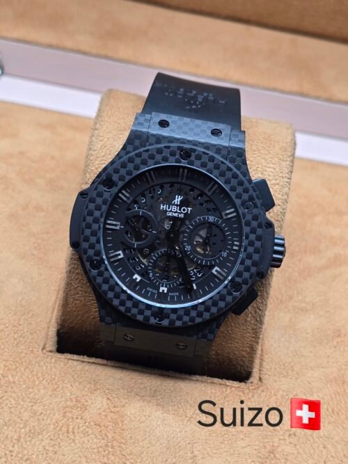 Hublot — esfera negra y caja con patrón de cuadros