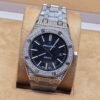 Audemars Piguet — esfera negra y brazalete brillante rosado