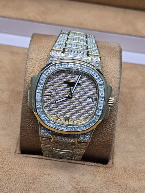 Patek Philippe — esfera brillante y brazalete dorado