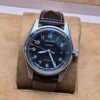 Longines — esfera negra y correa marrón