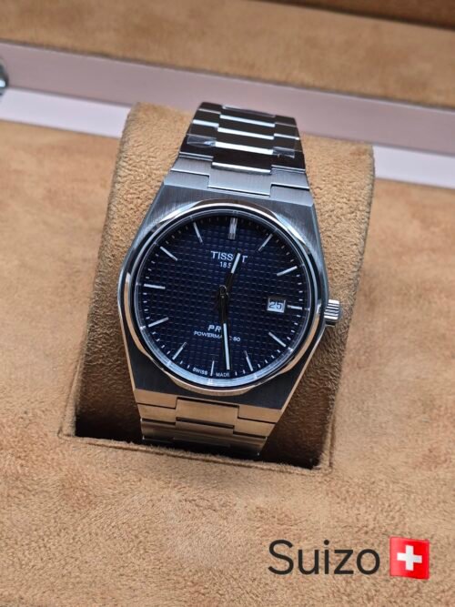 Tissot — esfera negra texturizada y brazalete plateado