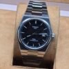 Tissot — esfera azul texturizada y brazalete plateado