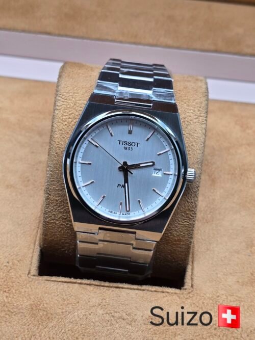 Tissot — esfera clara y brazalete plateado