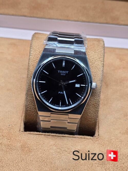 Tissot — esfera negra lisa y brazalete plateado