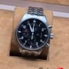 IWC — esfera negra con subesferas y brazalete plateado