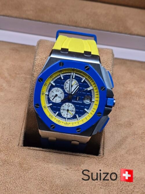 Audemars Piguet — caja azul y correa amarilla
