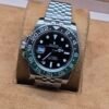 Rolex — bisel negro y verde · corona izquierda