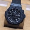 Hublot — esfera negra y caja de cuadros