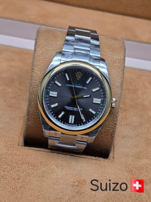 Rolex — esfera gris y bisel dorado