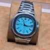 Patek Philippe — esfera turquesa y brazalete plateado