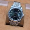 Rolex — esfera verde oscuro y bisel estriado