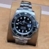 Rolex — esfera negra y brazalete plateado