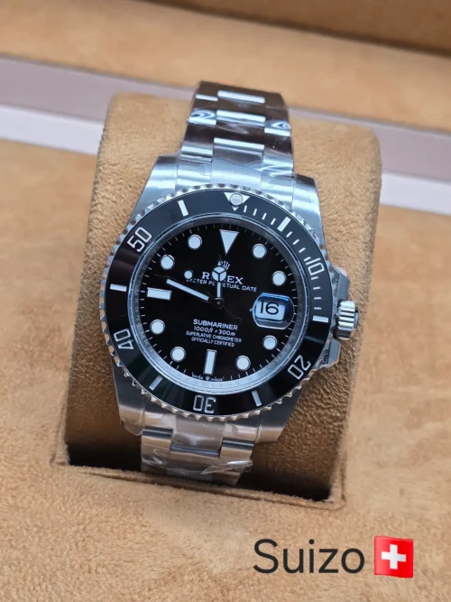 Rolex — esfera negra y brazalete plateado