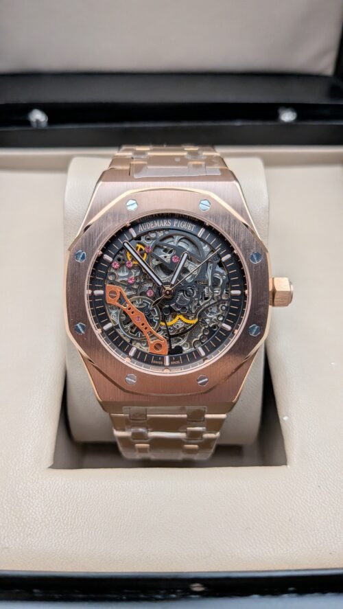 Audemars Piguet — esfera esqueleto con detalles naranjas, caja y brazalete oro rosa