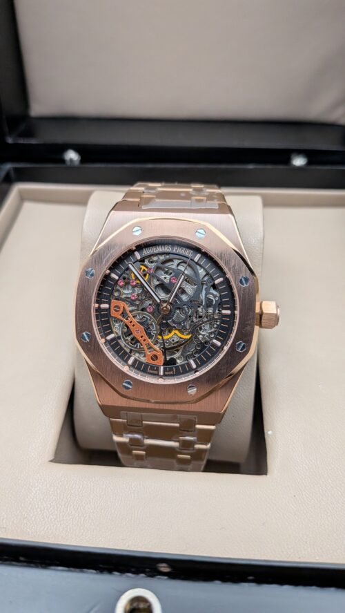 Audemars Piguet — esfera esqueleto con detalles naranjas, caja y brazalete oro rosa