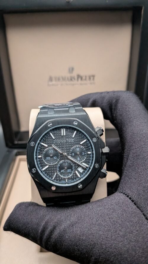 Audemars Piguet — cronógrafo con esfera gris oscura, caja y brazalete negros