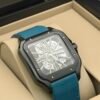 Cartier — caja cuadrada negra, esfera esqueleto y correa azul petróleo