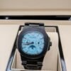 Patek Philippe — esfera azul celeste con fases lunares, caja y brazalete negros