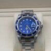 Rolex — esfera azul, bisel de piedras azules y caja con brillantes, brazalete de acero